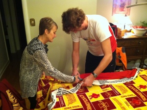 Deb and the Iron Hippie cutting fabric for one of the fleece blankets we made Thanksgiving evening.