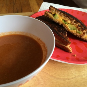 Homemade tomato soup with a grill cheese sandwich (avocado...one of my favorite touches in a grill cheese)